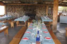 Outdoor tables, set for lunch.